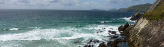 rocks and sea at slea head with blasket islands in the background