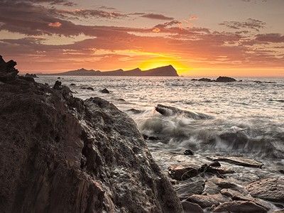 Dooneen with sunset behind the three sisters Dingle Peninsula by George Jackson